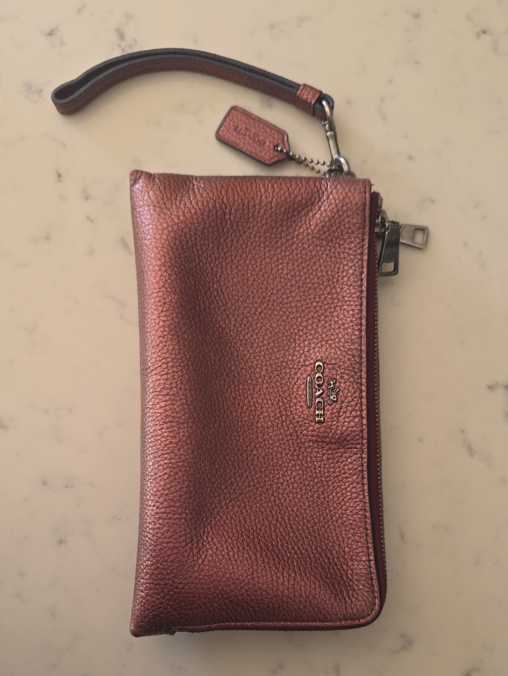 Coach Metallic Burgundy Rose Gold Pebbled Leather Wristlet Phone Case